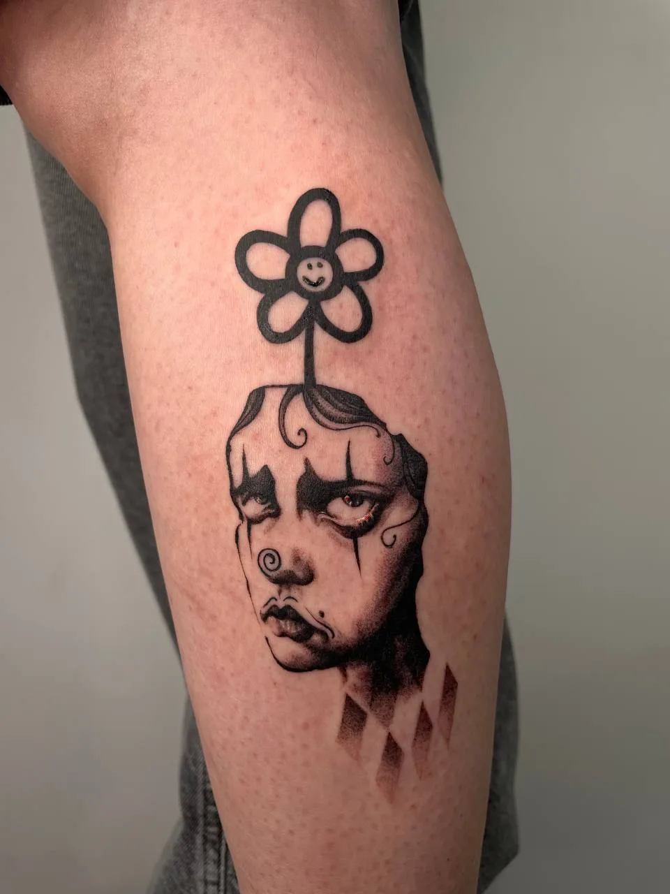 Clown flower tattoo