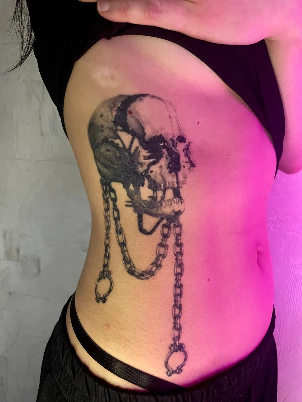 Skull chain tattoo